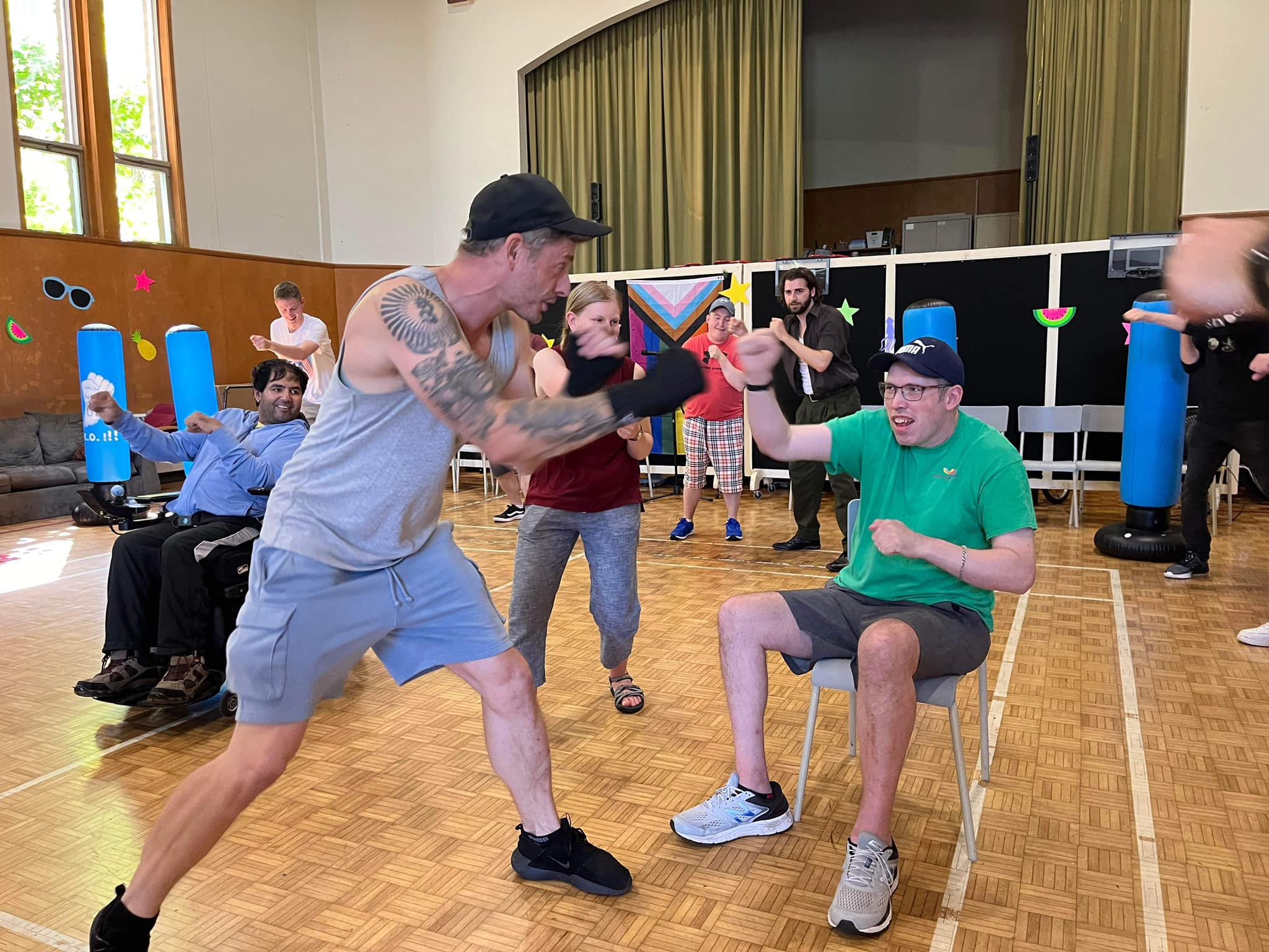 Participants in a gym learning how to box